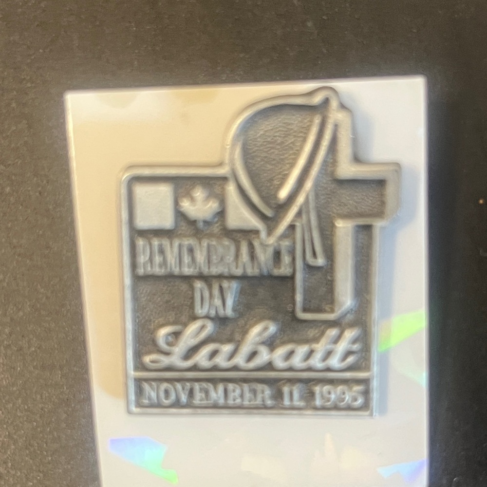Silver Pin with Cross and Helmet Design